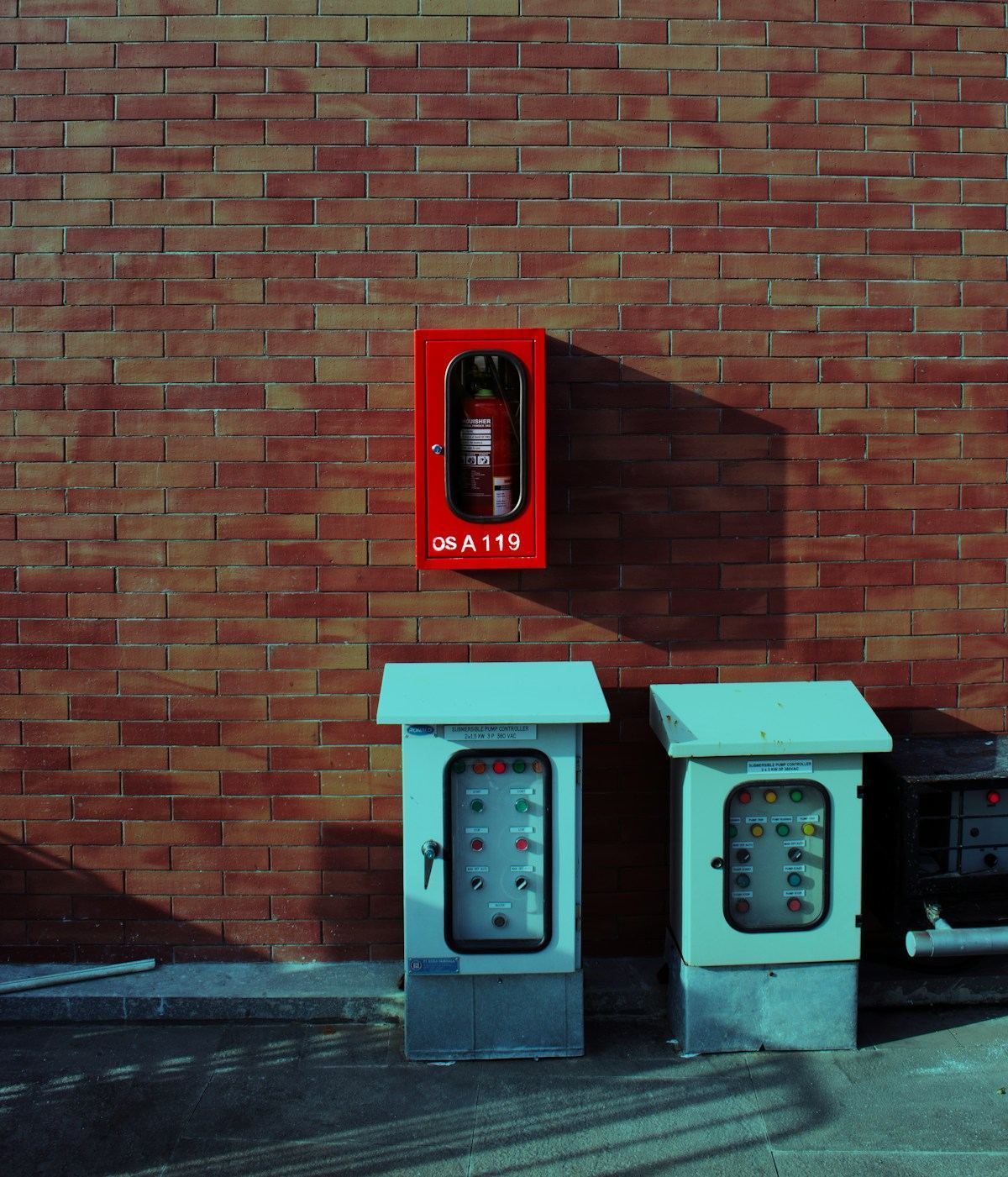 Fire extinguisher next to a residential electrical panel — preparedness for electrical hazards