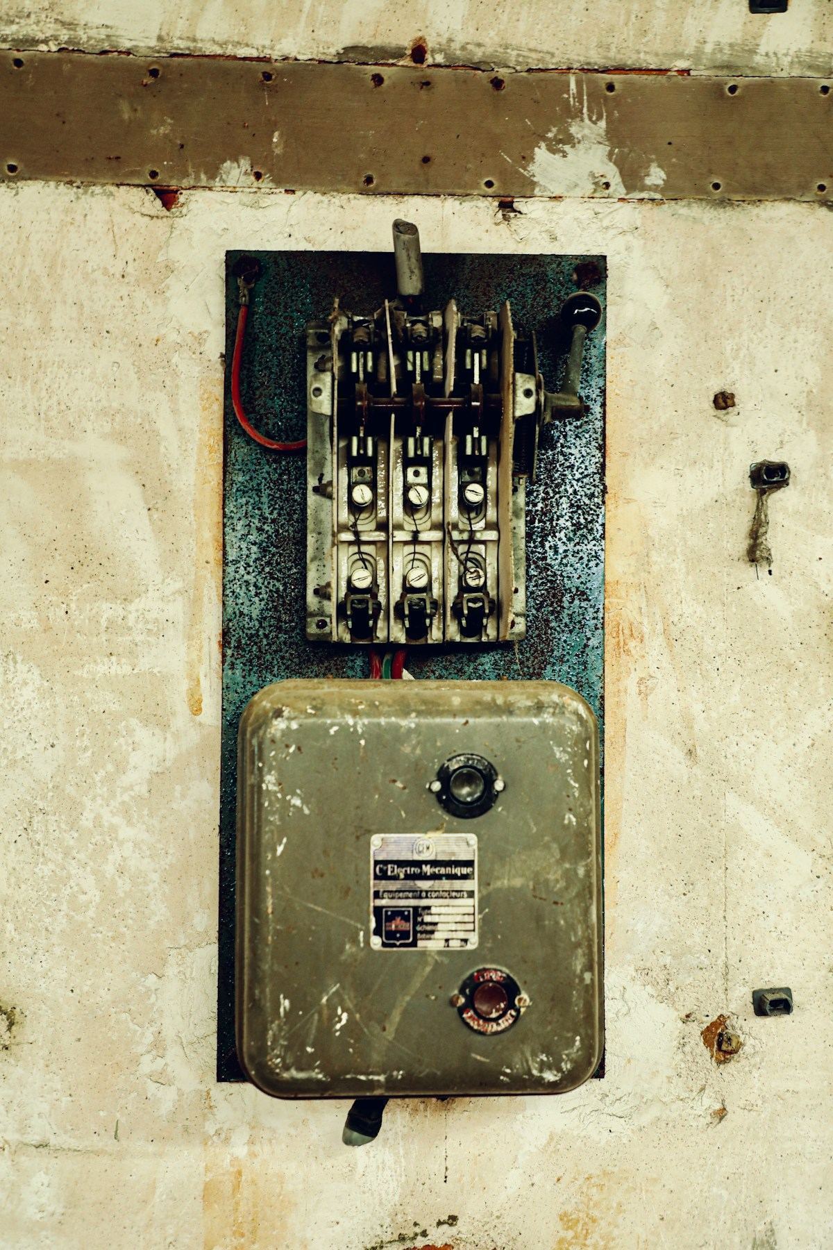 Older-style residential electrical panel — the kind that may be a Federal Pacific, Zinsco, or Pushmatic
